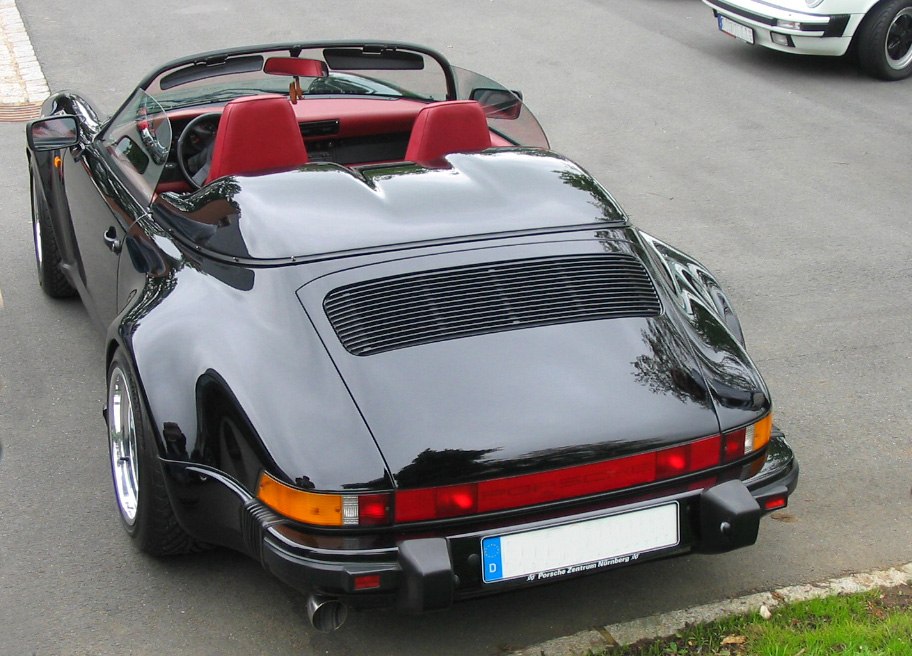 Convertible rear view with red seats and black body