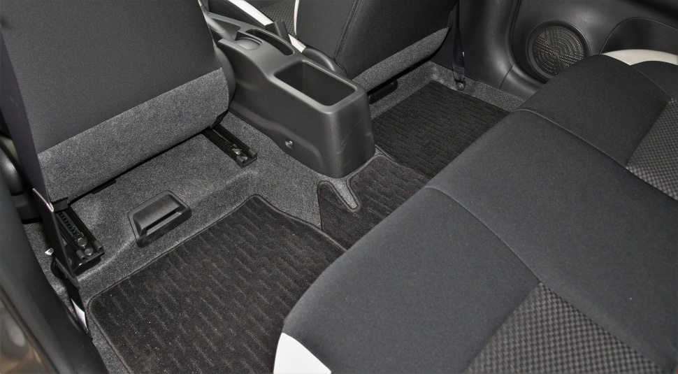 Rear seat base and carpeted floor area with center console storage