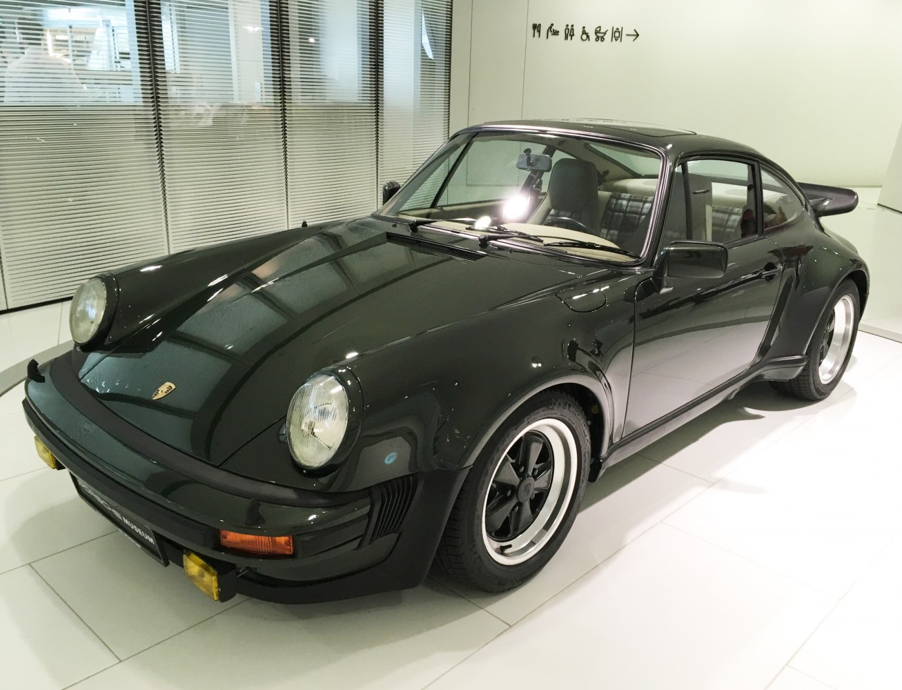 Classic coupe with round headlights and distinctive wide fenders