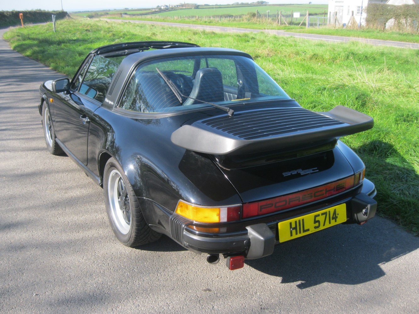 Distinctive rear spoiler and curved rear glass on a classic Targa style rear.