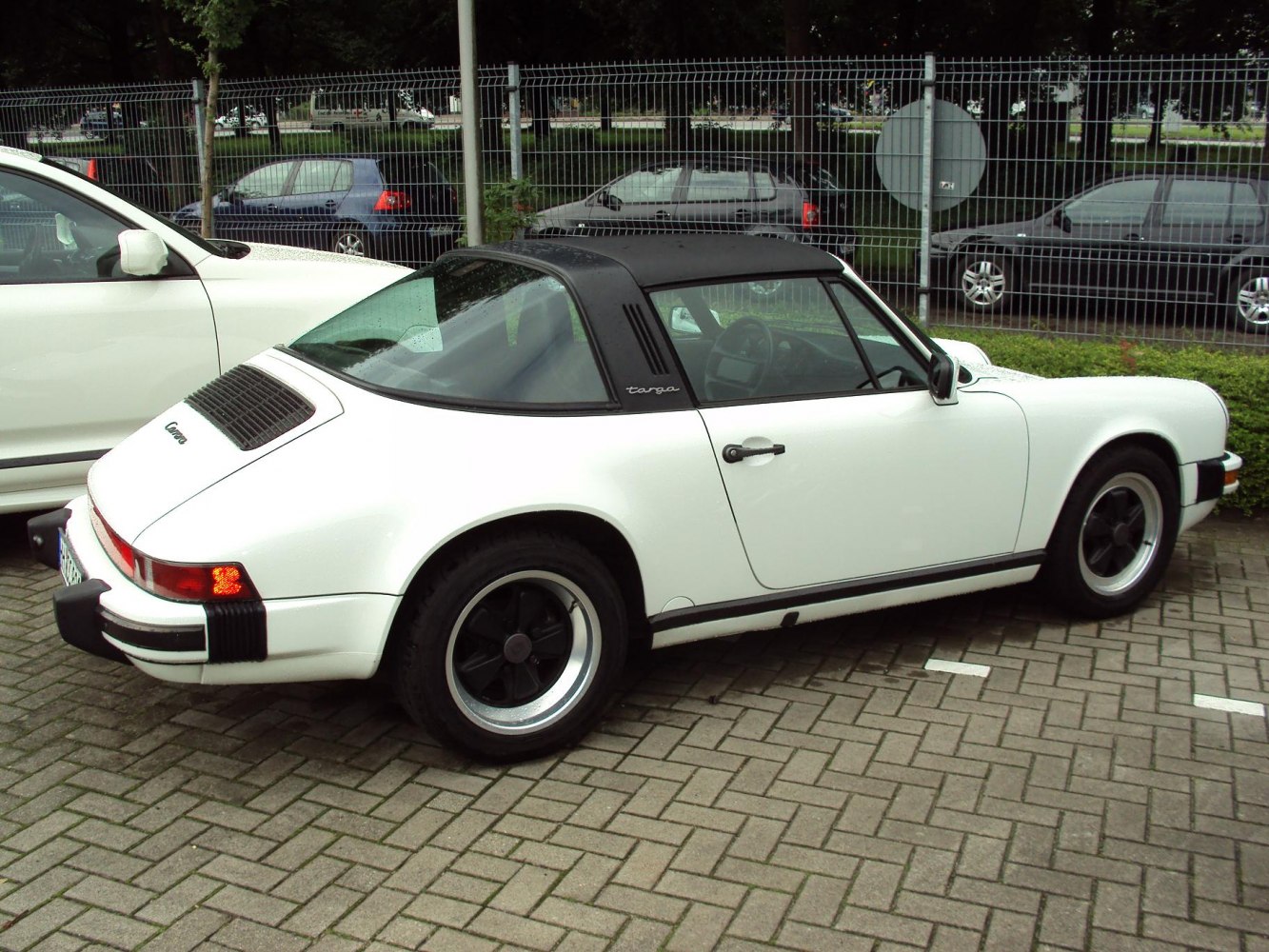 White Porsche with removable black Targa roof and black Fuchs wheels
