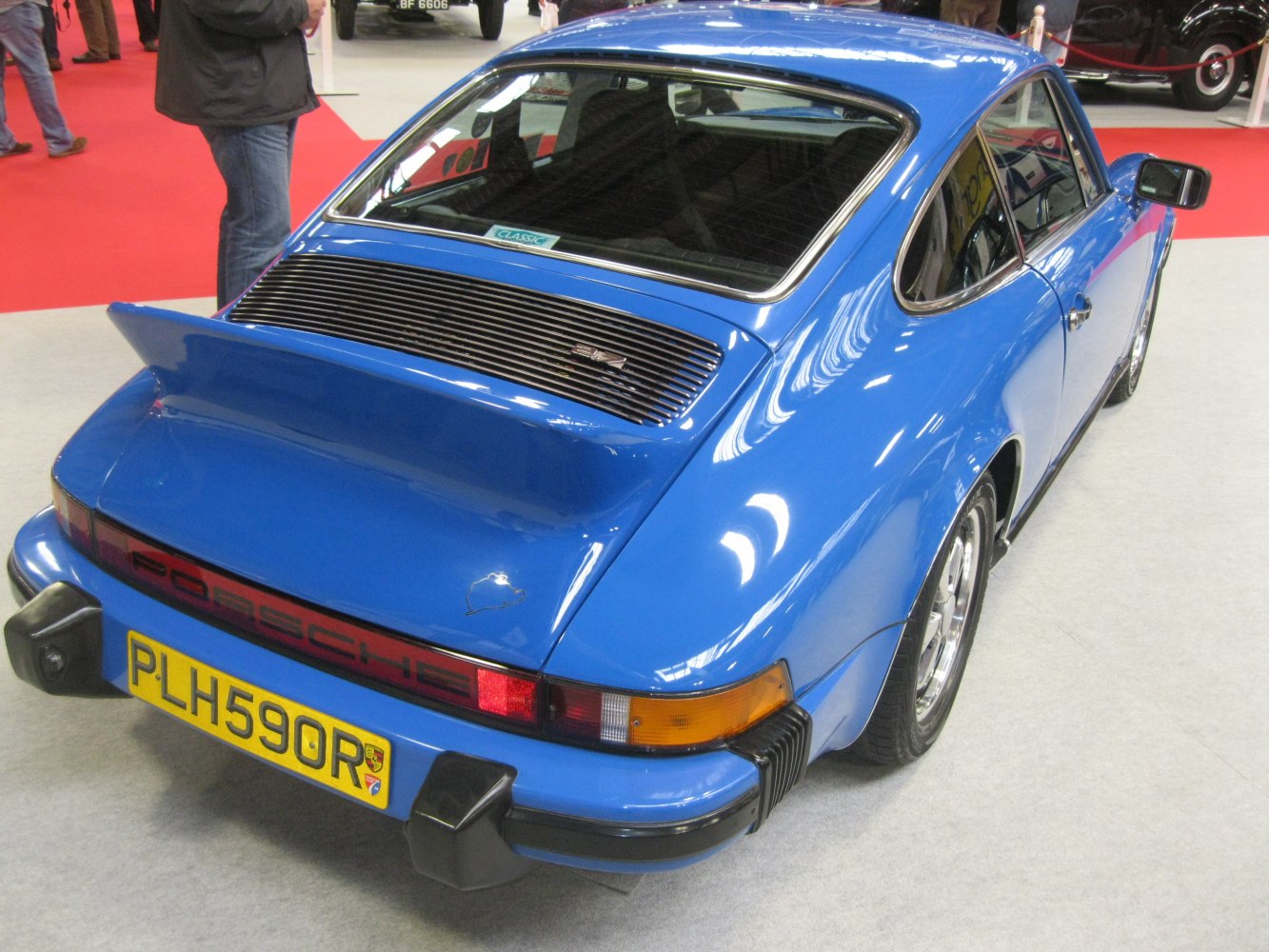 Rear with whale tail spoiler and rear grille.