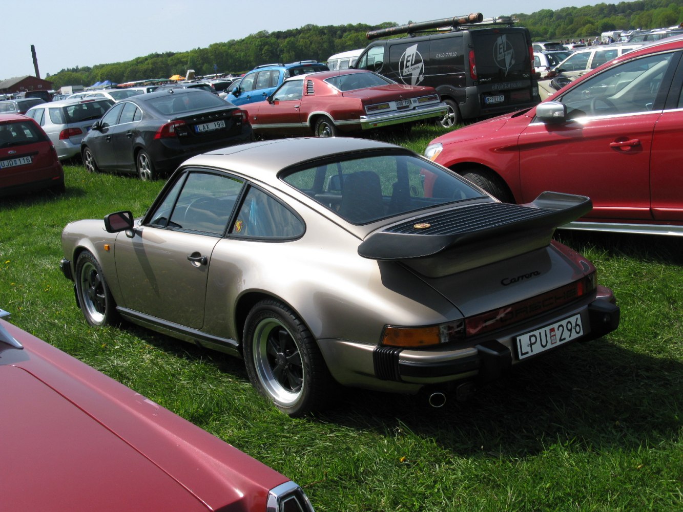 Vintage sports coupe with rear spoiler and streamlined silhouette