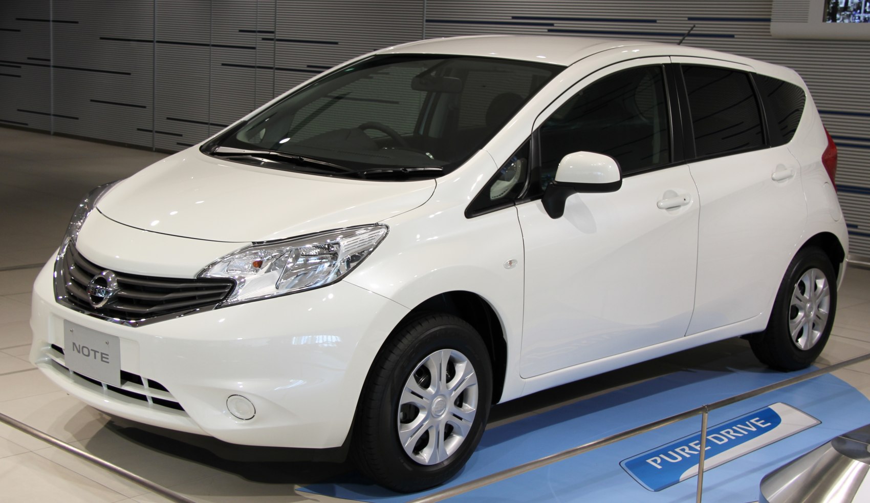 White compact hatchback with aerodynamic front design