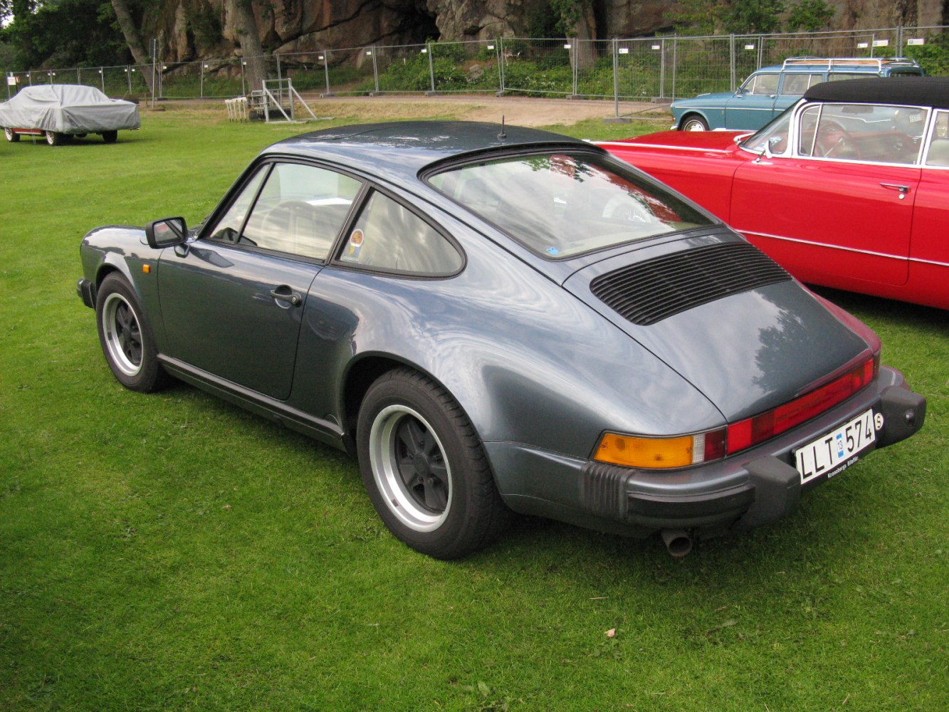 Rear view with wide back window, rear vents, and iconic taillight strip