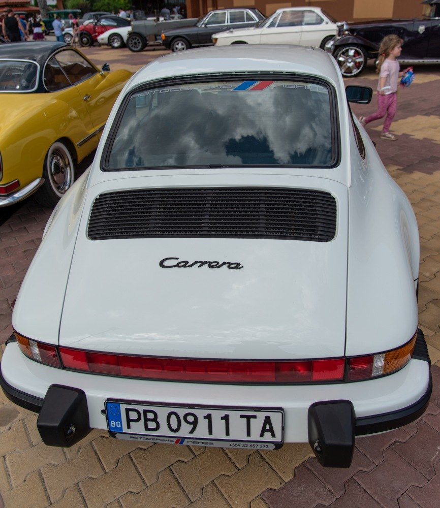 Rear view of a classic sports car with Carrera badge and rear ventilation grille