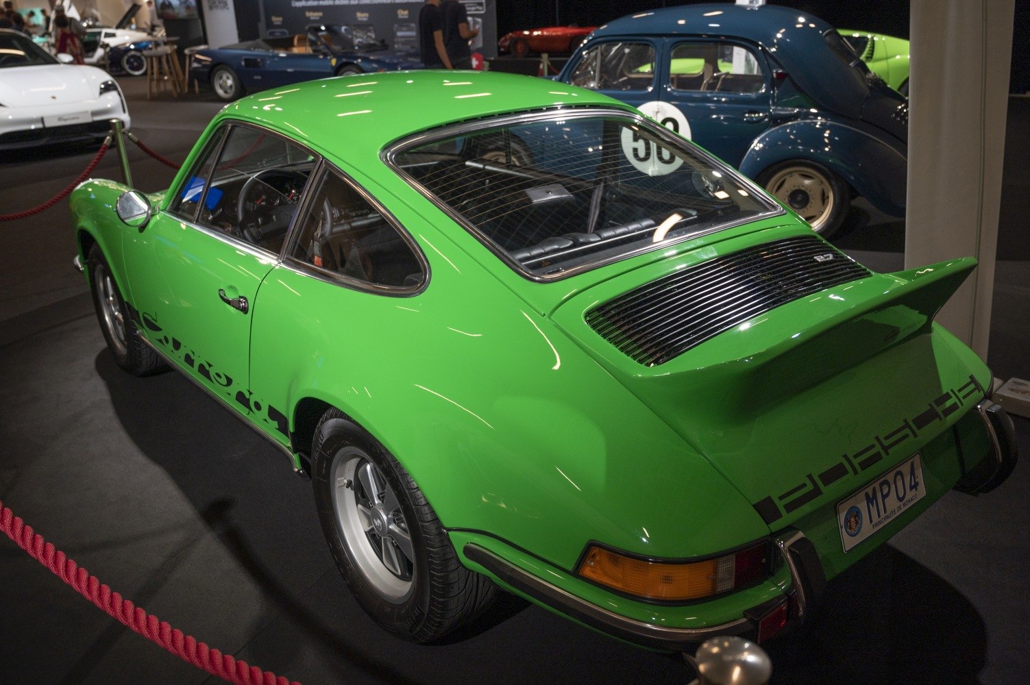 Green vintage coupe with rear spoiler and Fuchs wheels