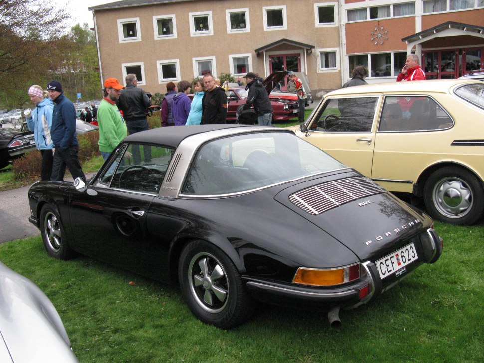 Rear view of a classic Porsche 911 Targa with Targa roof and vintage design elements.
