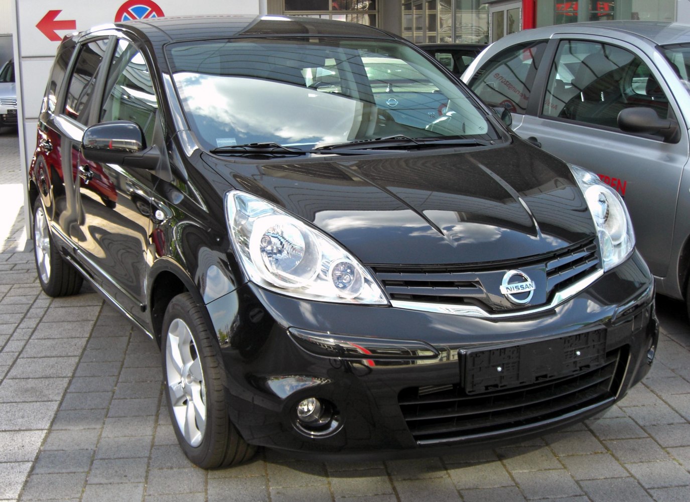 Front view of car with headlights and grille