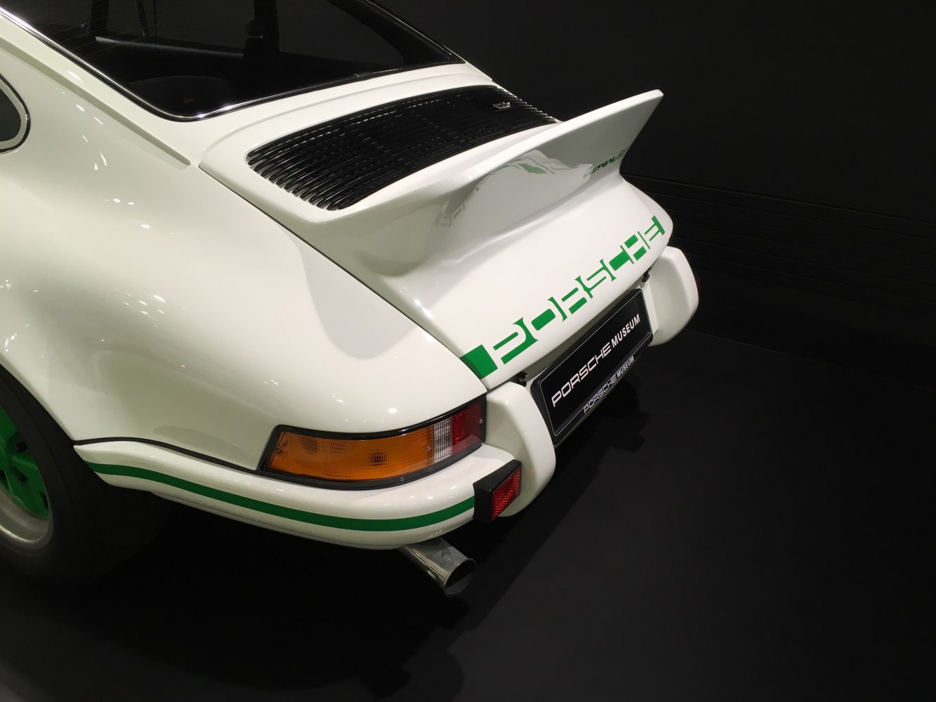 Rear view with whale tail spoiler and vintage tail lights.