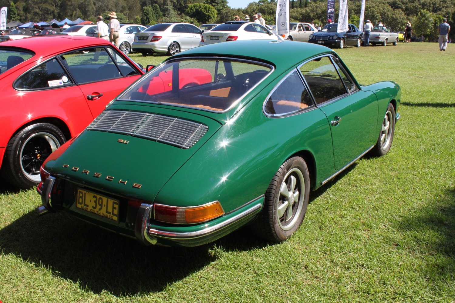 Classic vintage sports coupe rear in green with chrome bumpers and detailed rear window