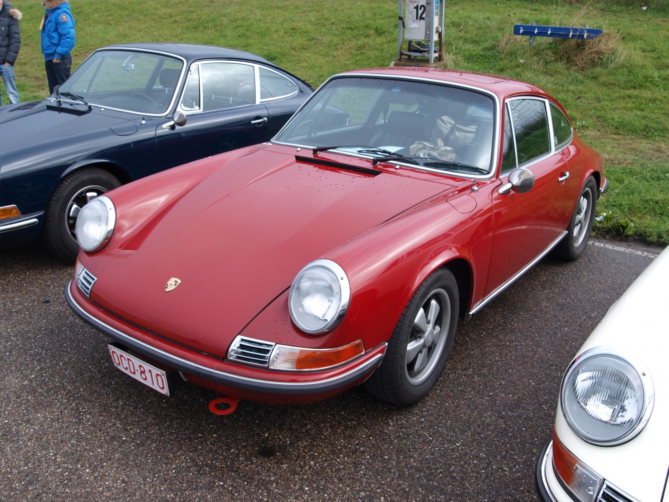 Vintage sports coupe with round headlights and curved fenders