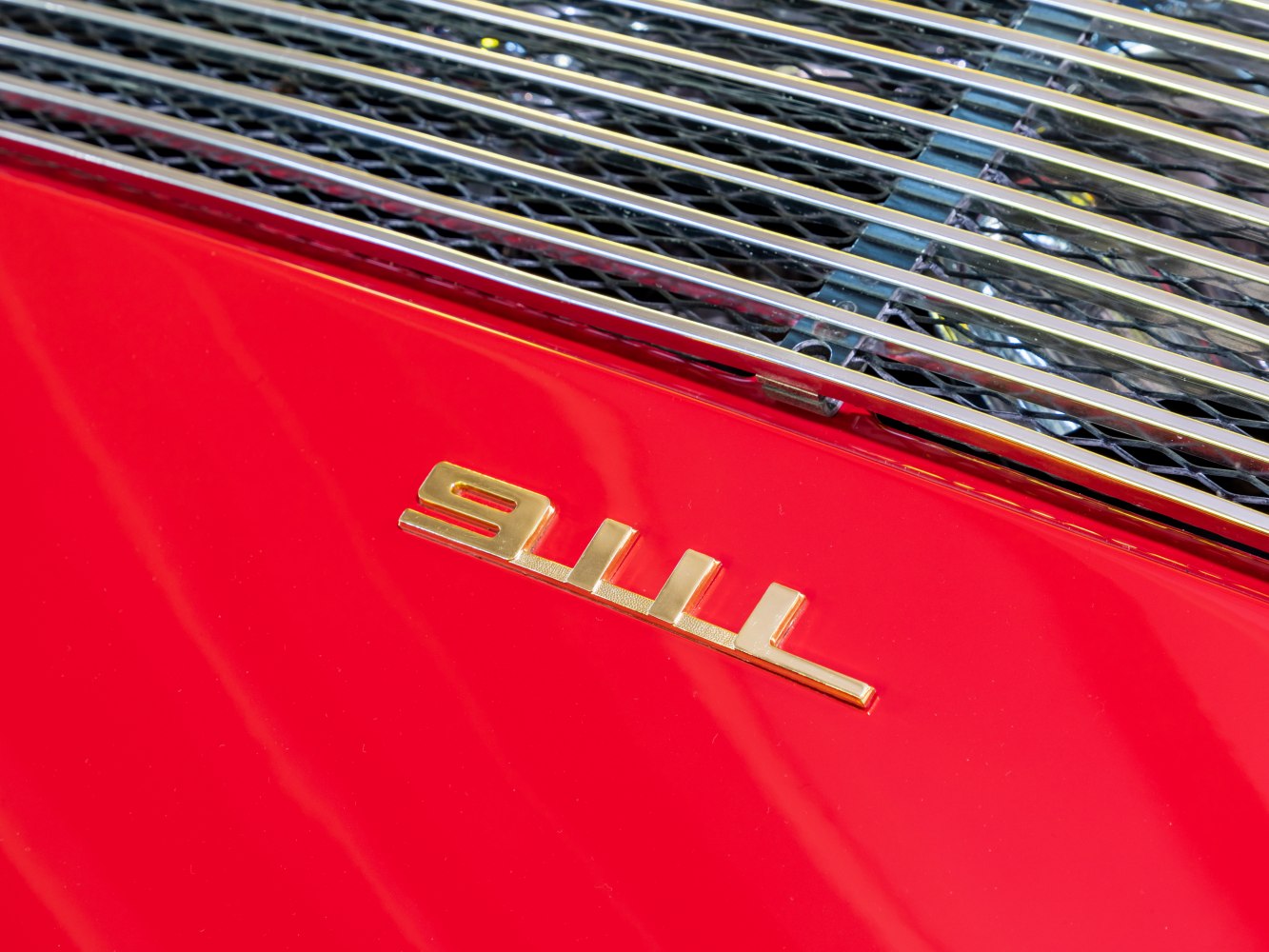 Close-up of vintage rear badge and engine grille