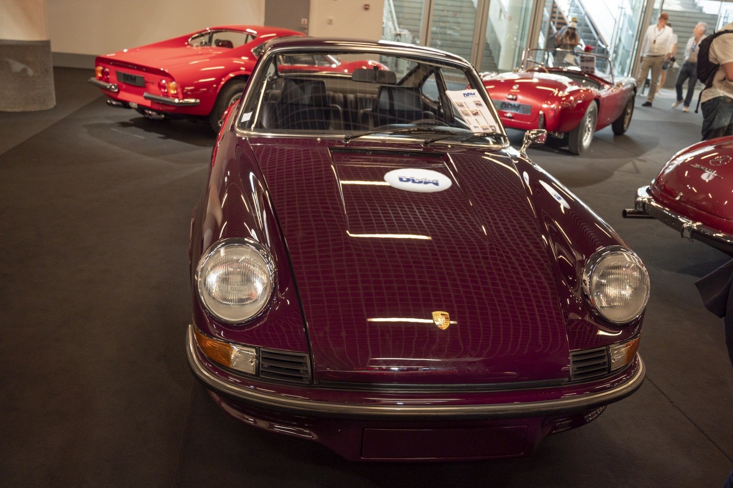 Classic 1960s sportscar front with round headlights