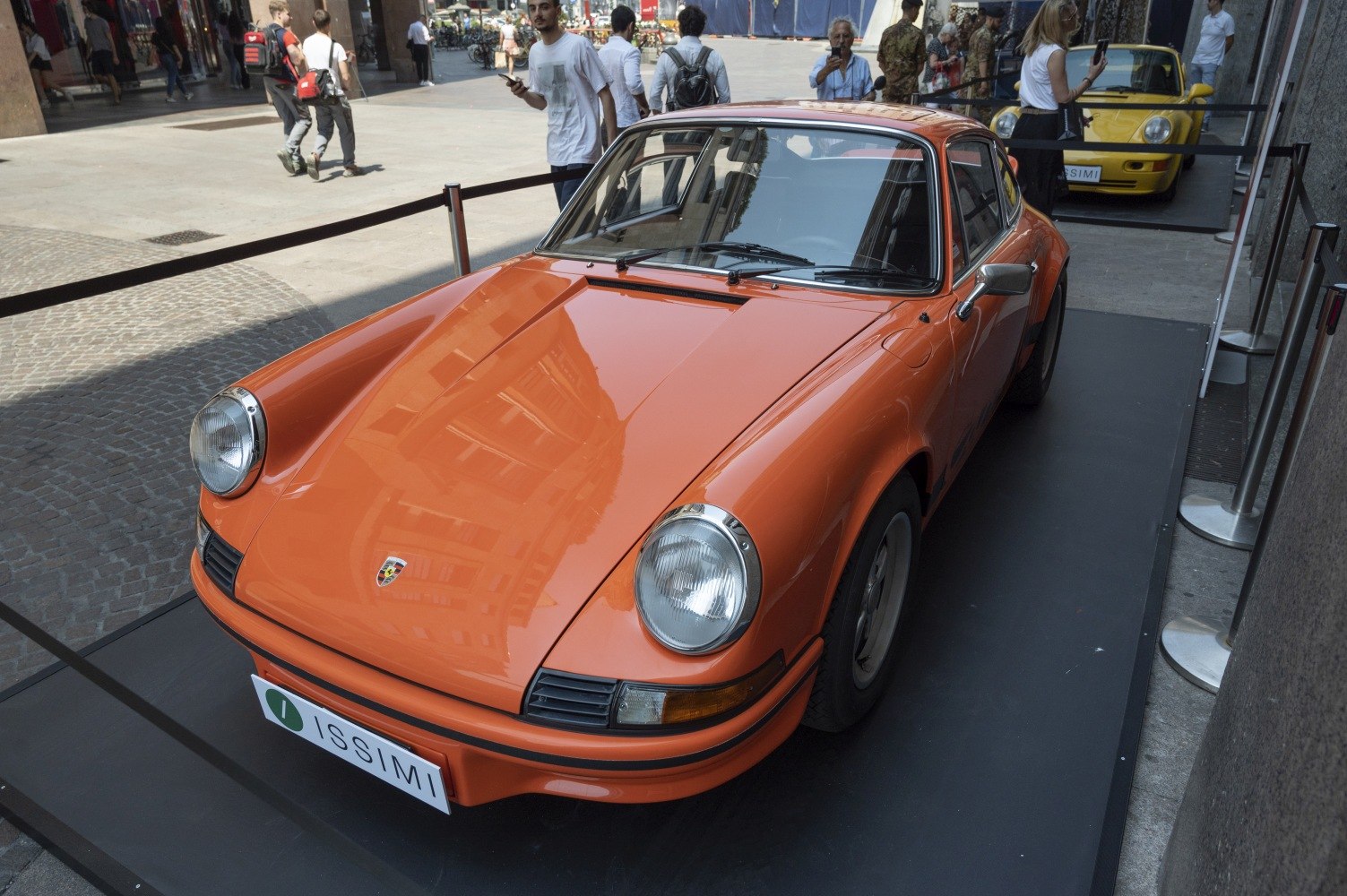 Front view of classic vintage coupe with round headlights and smooth lines.