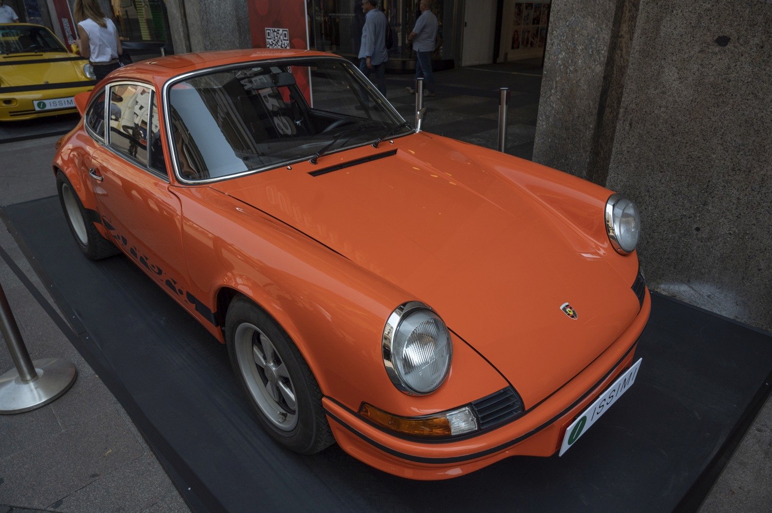 Vintage sports coupe with rounded headlights, sleek aerodynamic body, and classic wheels.