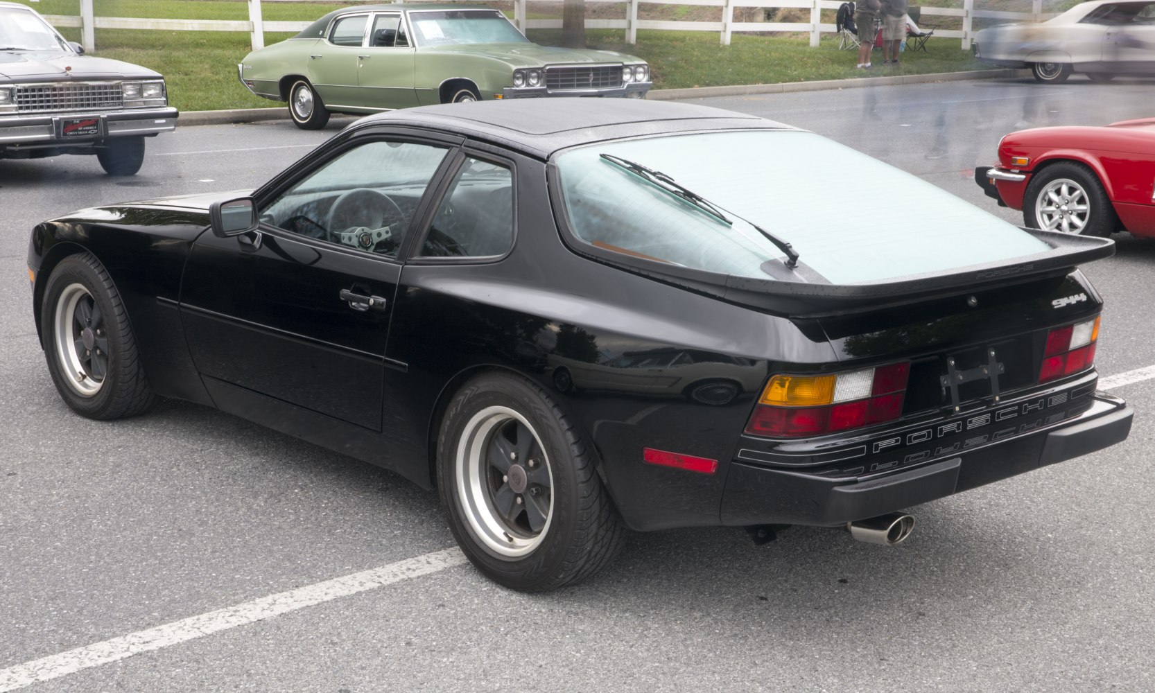 Rear side view of a classic hatchback sports coupe with distinctive spoiler