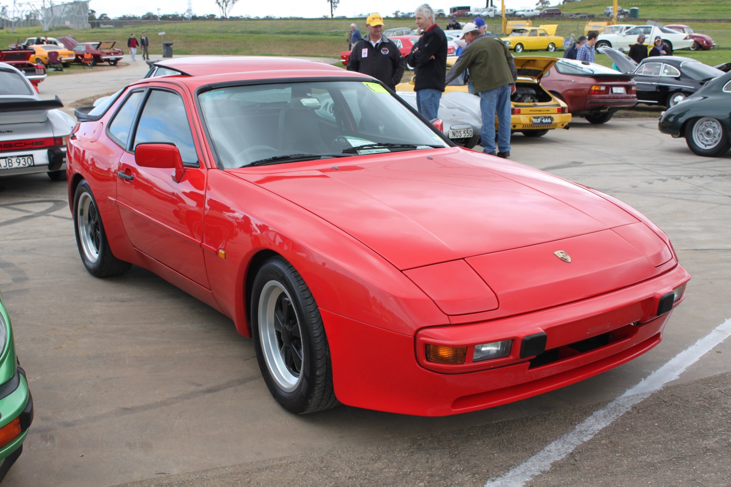 Red sports coupe with pop-up headlights and aerodynamic design