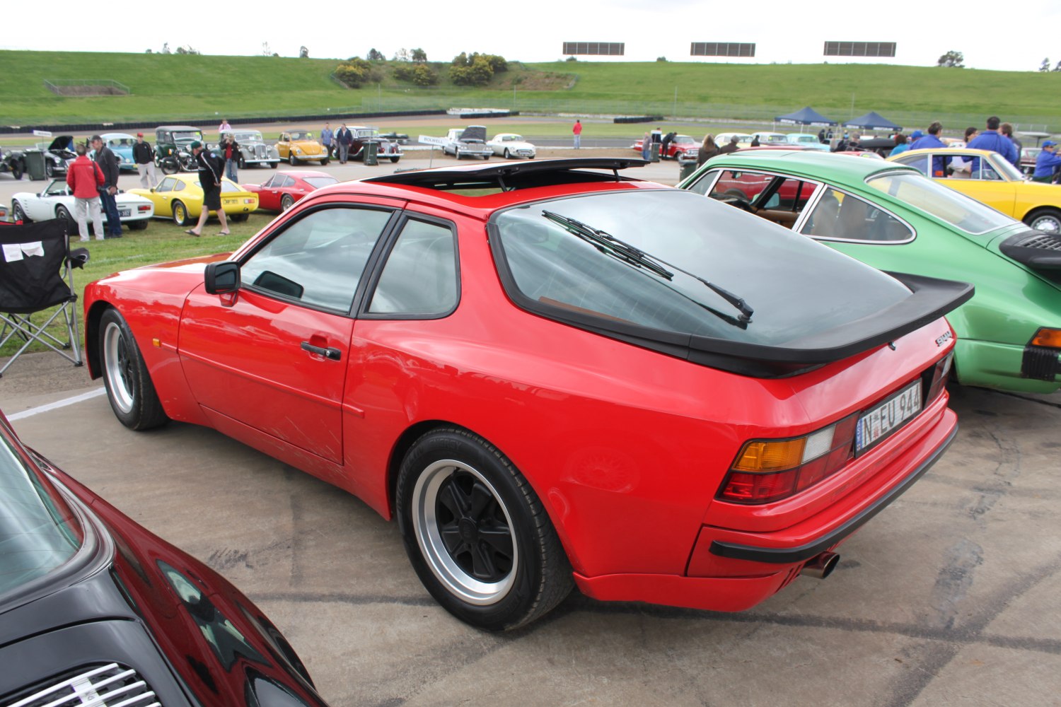 Red sports coupe with rear window wiper and sunroof