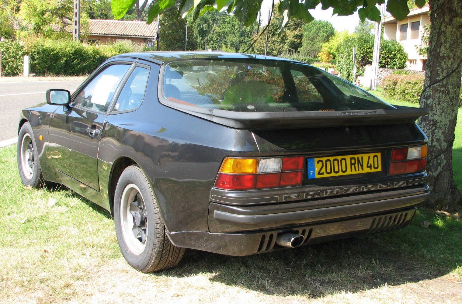Rear hatch, tail lights, and spoiler of a sporty hatchback coupe