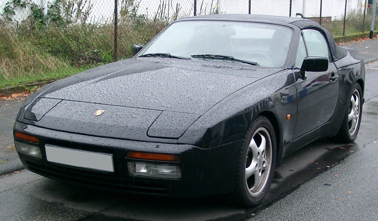 Convertible with pop-up headlights and sleek rounded body shape