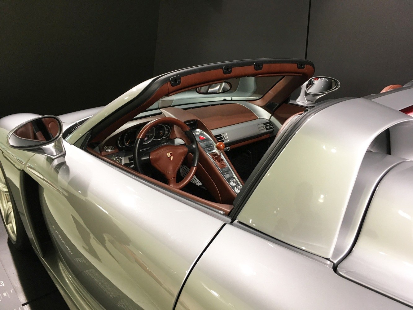 Sleek silver exterior with brown leather interior details