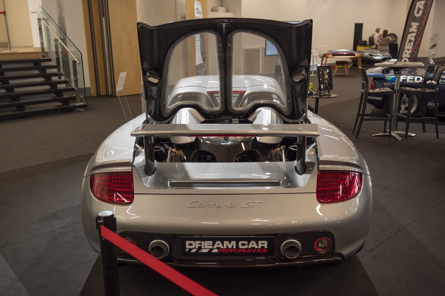 Rear view with open engine cover and visible V10 engine