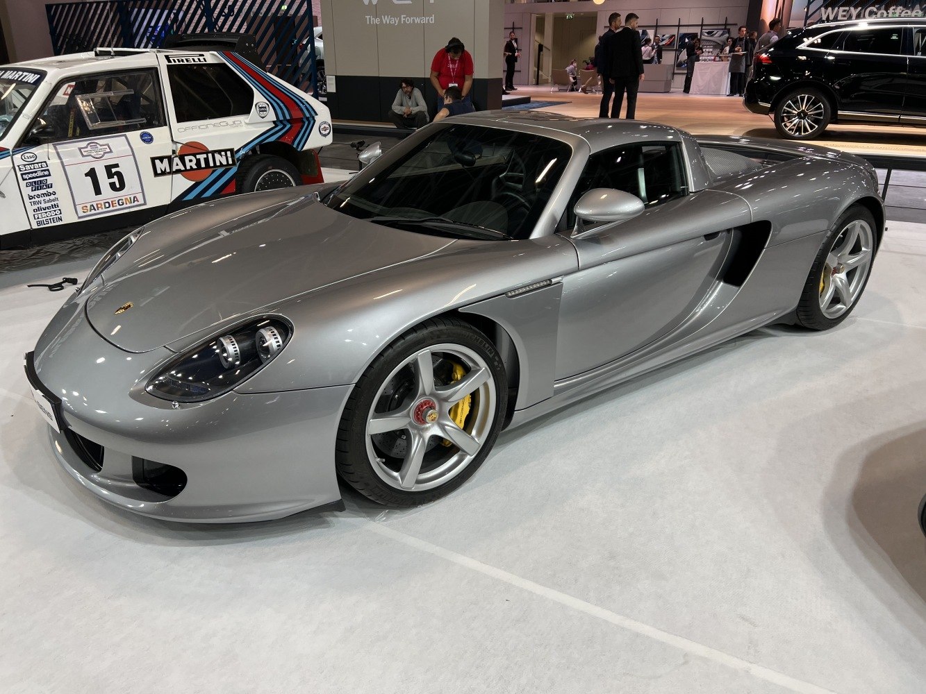 Silver sports coupe with aerodynamic body and five-spoke wheels