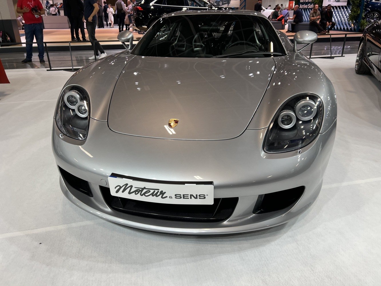 Front view with distinctive circular headlights and aerodynamic design