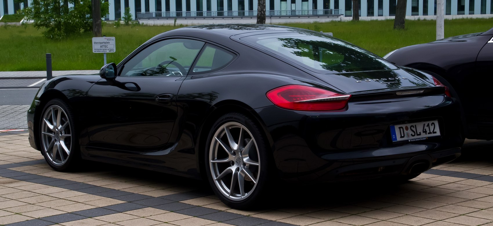 Sleek rear and side view with alloy wheels and rear lights