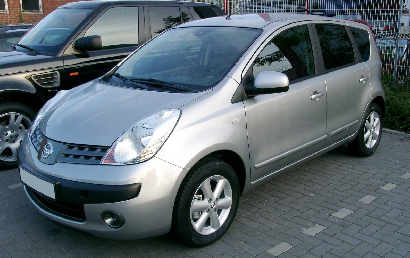 Silver compact hatchback with front side view and alloy wheels