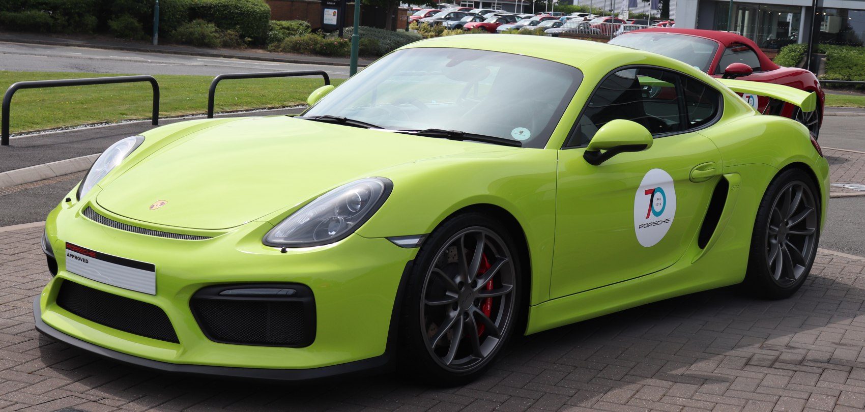 Bright green sports coupe with rear spoiler and aggressive aerodynamics