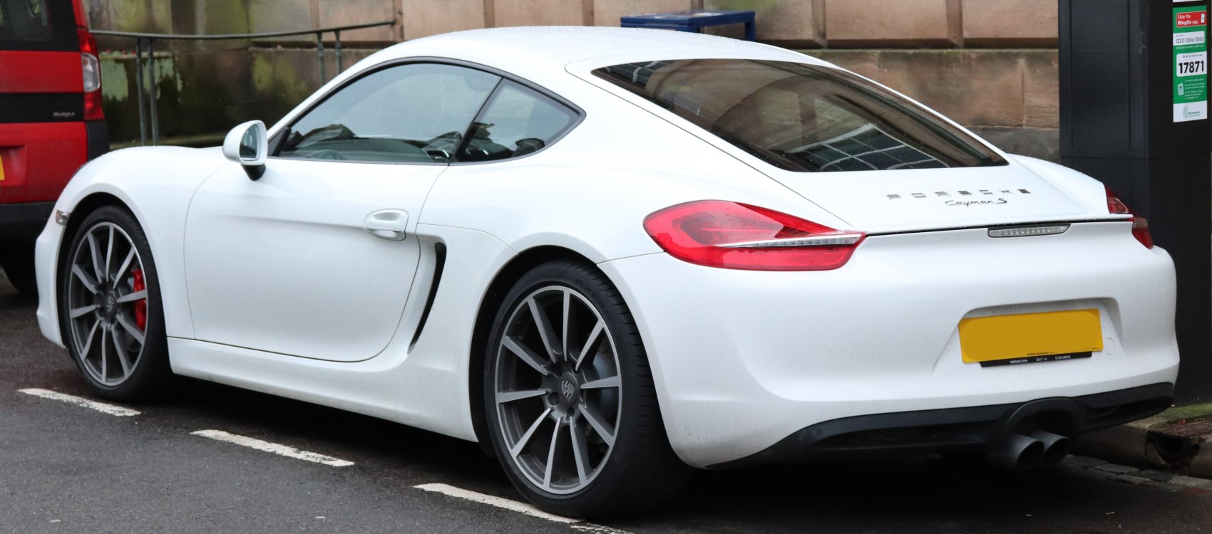 Rear side profile with alloy wheels and dual exhaust