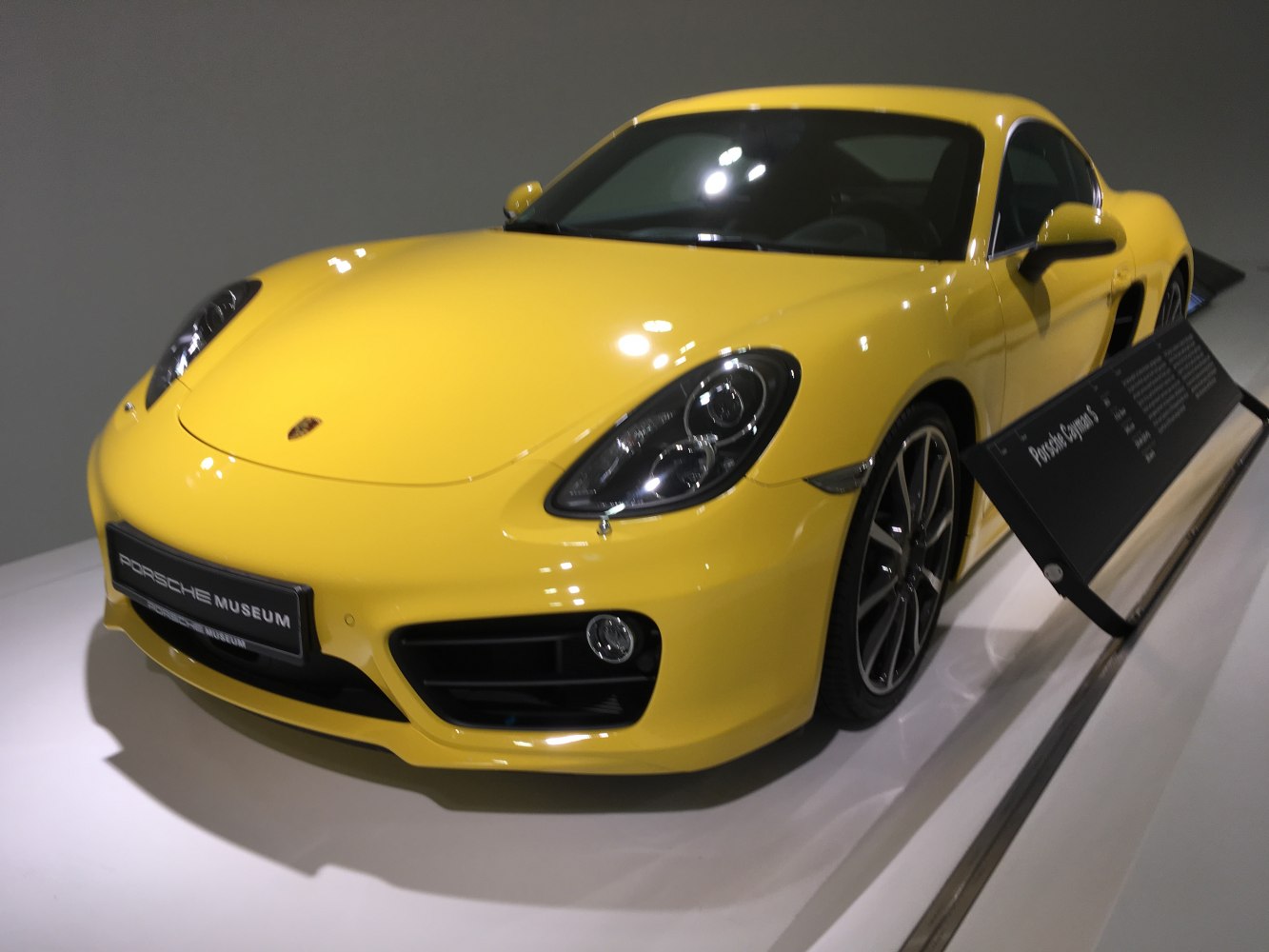 Front view with headlights and grille of a yellow sports coupe