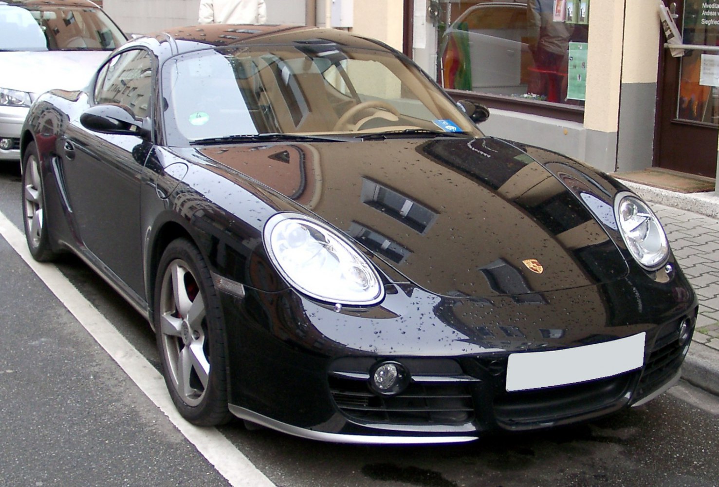 Black sports coupe with rounded headlights and sleek front design