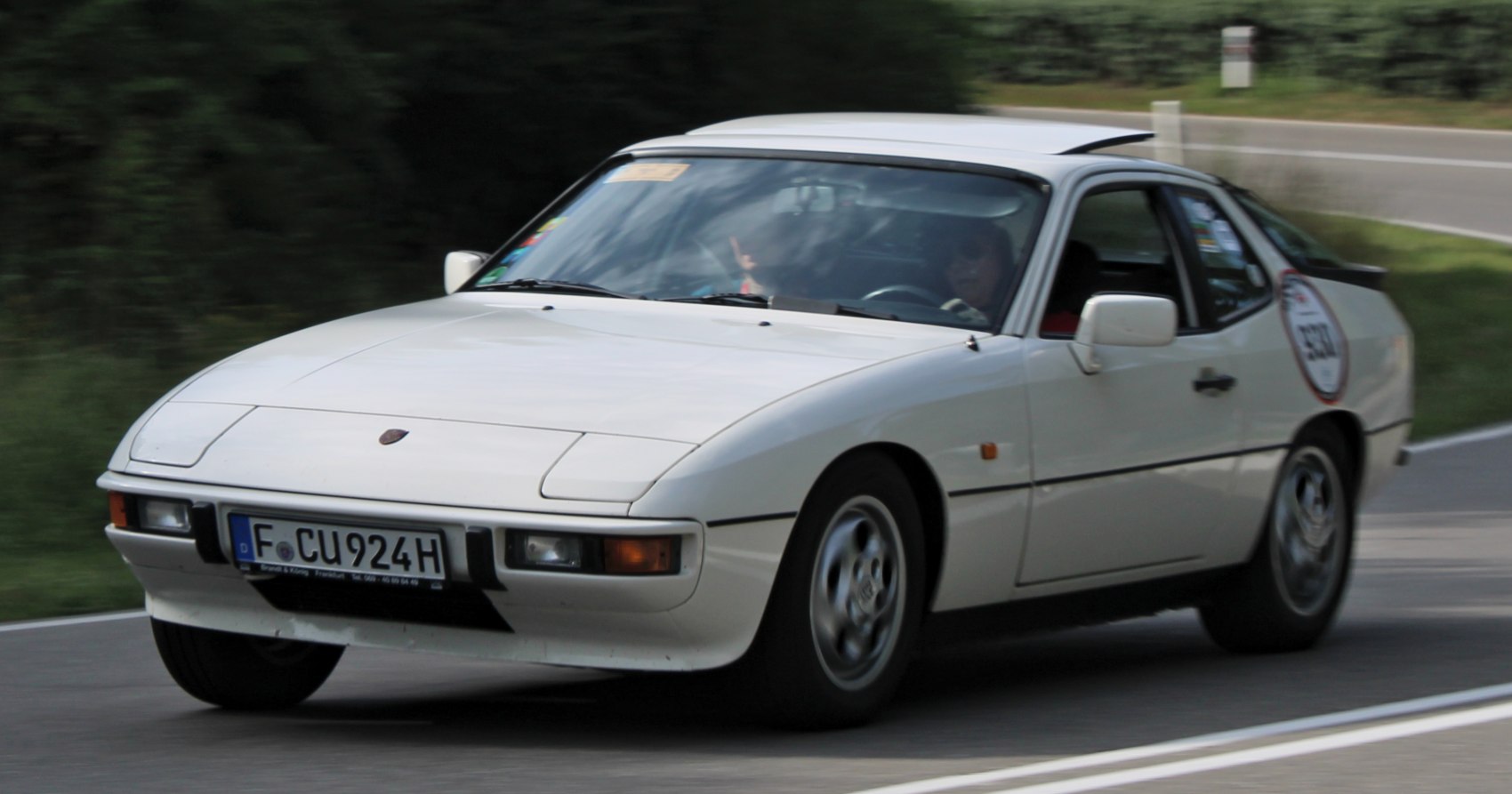 Sleek front view of a classic sports coupe in motion