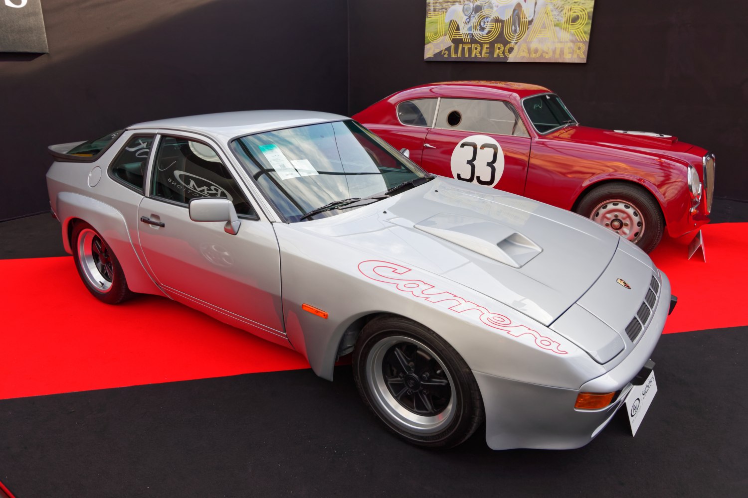 Silver classic sports coupe with aerodynamic body and hood scoop
