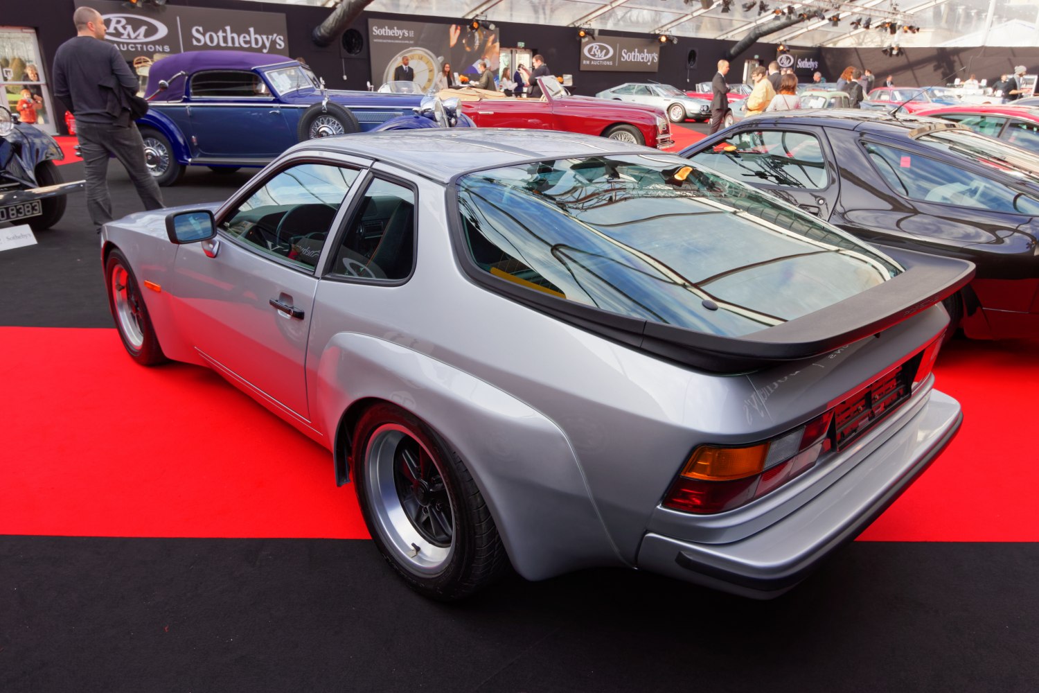 Rear angled view with wide fender flares and large rear spoiler