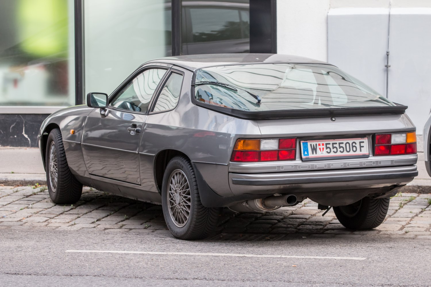 Rear view of a classic hatchback with distinctive taillights and rear window design.