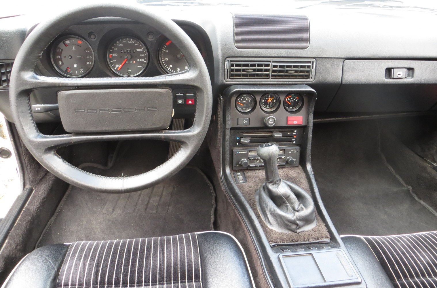 Vintage dashboard with gauges and manual gear shift