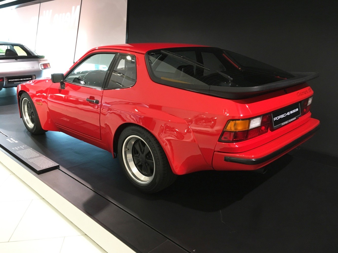 Red classic coupe with wide fenders and rear spoiler