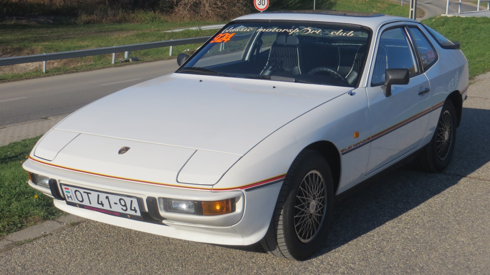 Front angle with pop-up headlights and classic sporty coupe design