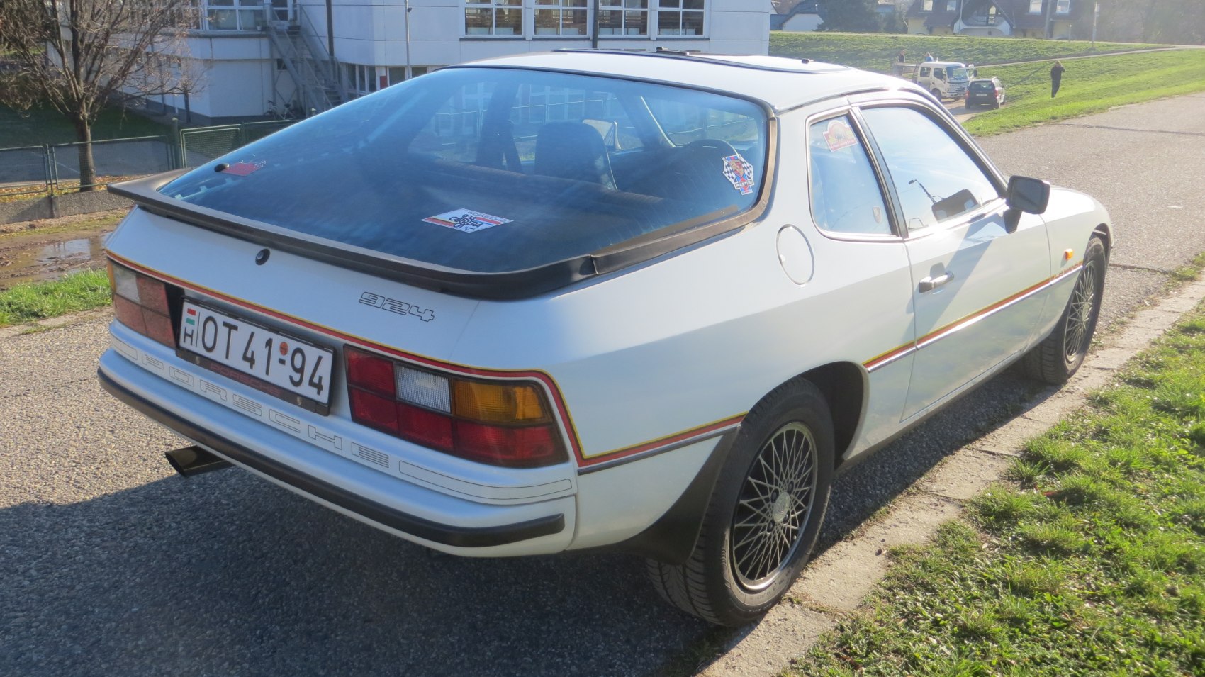Rear side view with tail lights and rear spoiler of a classic coupe