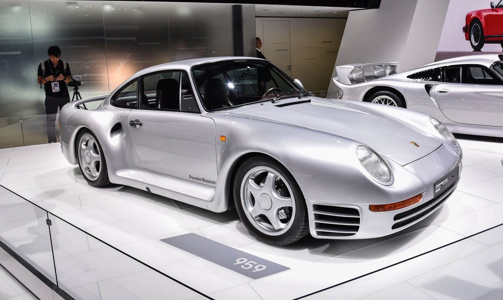 Silver sports coupe with aerodynamic bodywork and five-spoke wheels