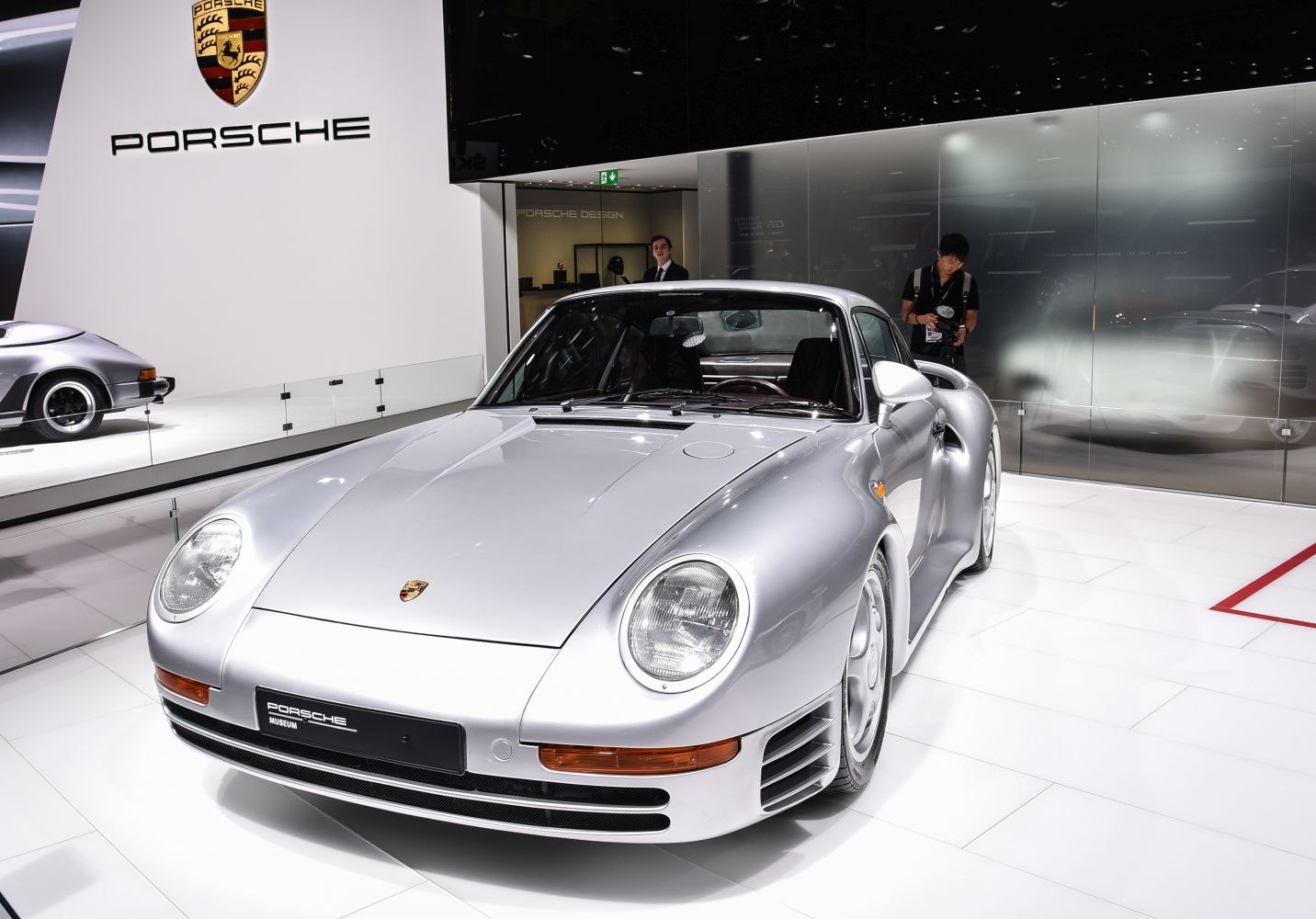 Silver car with rounded headlights and aerodynamic front view