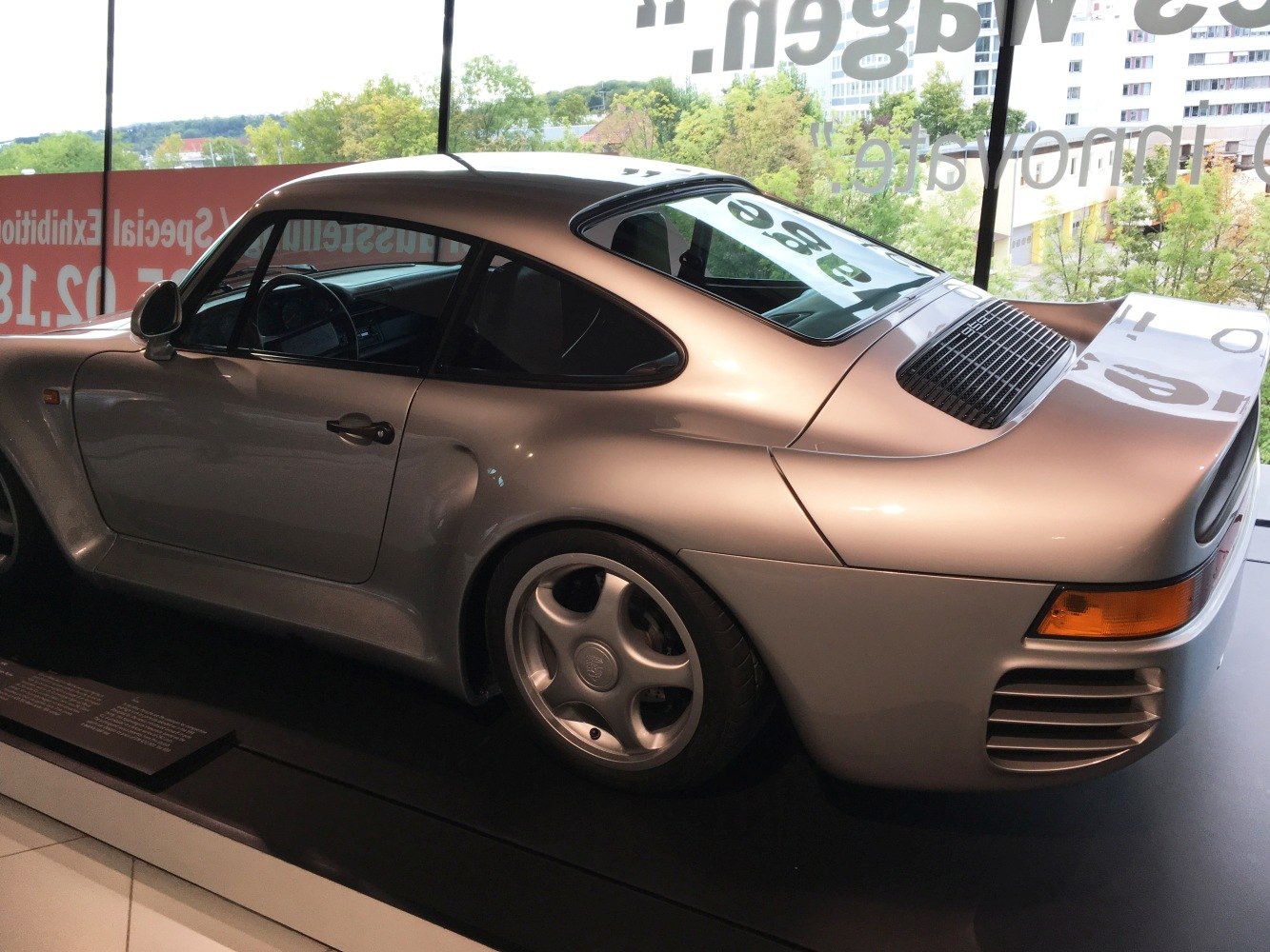 Rear side profile and aerodynamic wheel design with rear spoiler