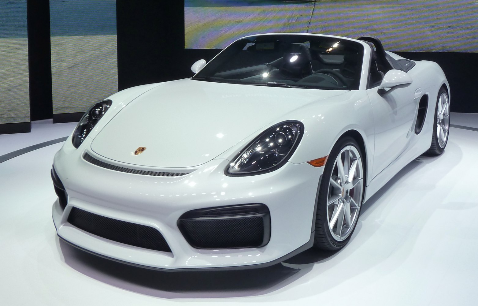 Convertible sports car with aerodynamic front and performance wheels
