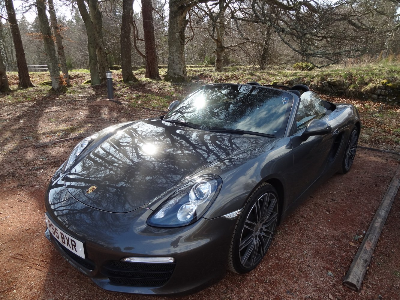 Convertible sports car front view with sleek design and alloy wheels