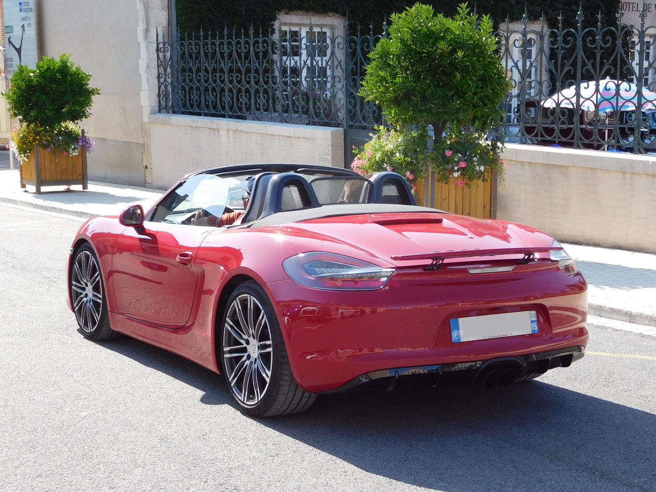 Convertible roadster rear with alloy wheels and spoiler