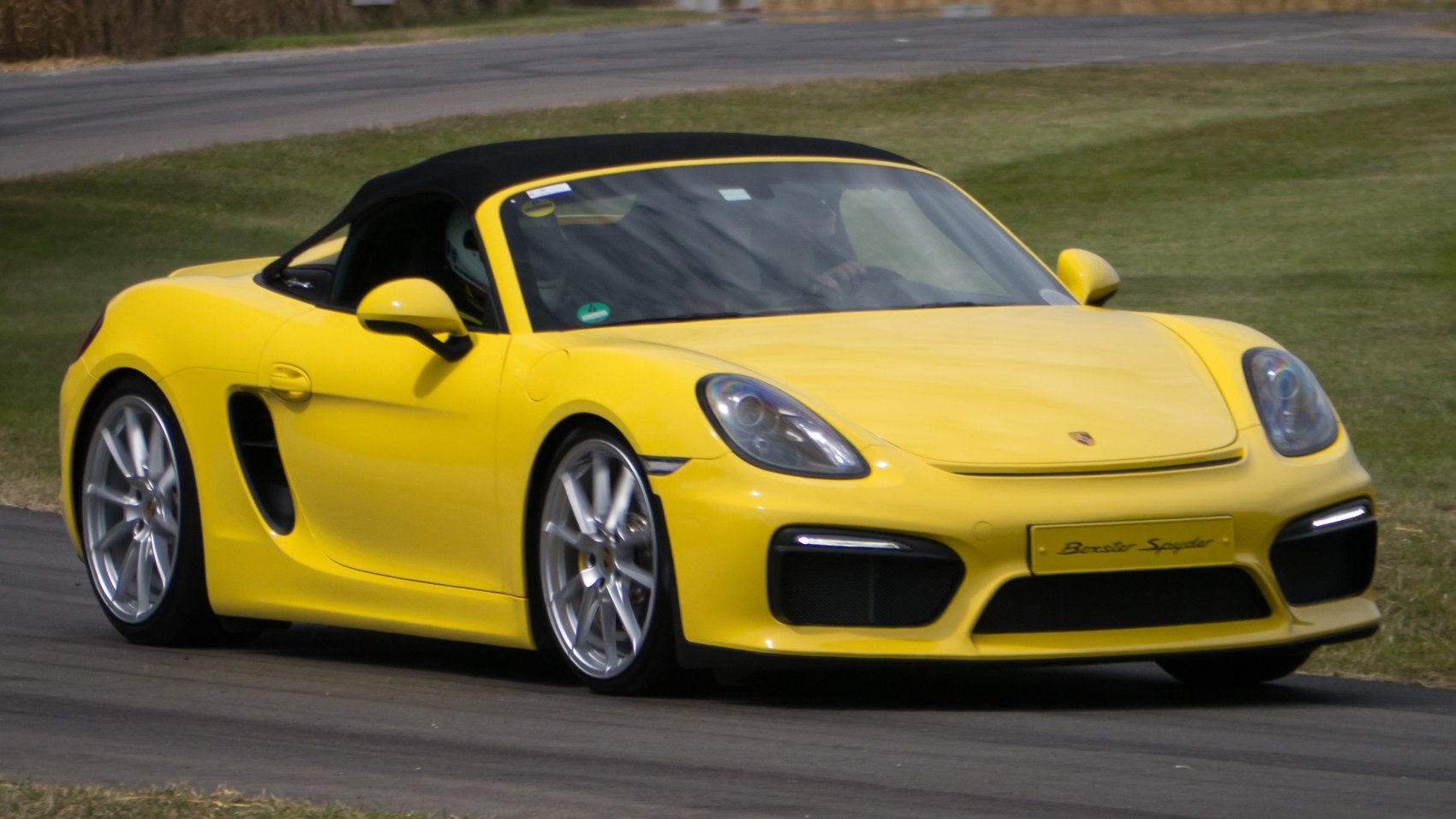 Yellow convertible sports car with sleek aerodynamic design